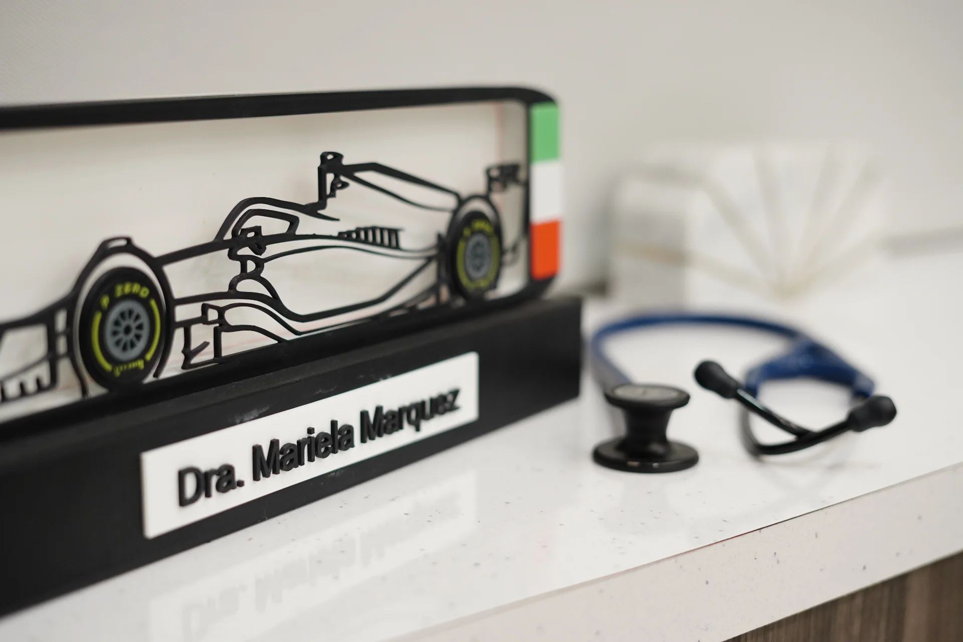 Overhead view of a doctor checking a patient's blood pressure during a healthcare consultation indoors.